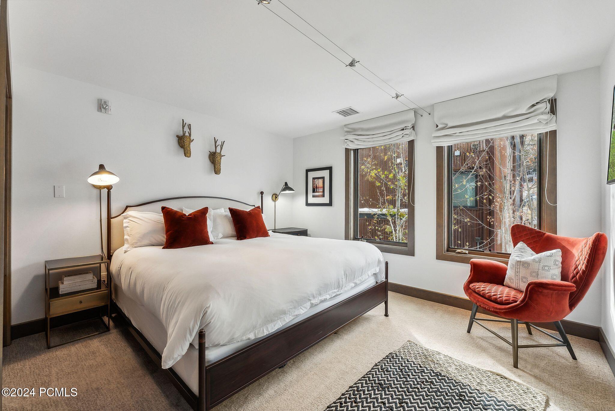 King bedroom with designer decor and mountain-inspired accents