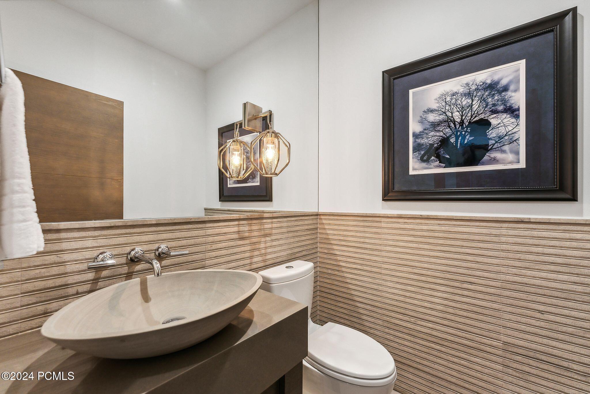 Designer powder room with oval vessel sink