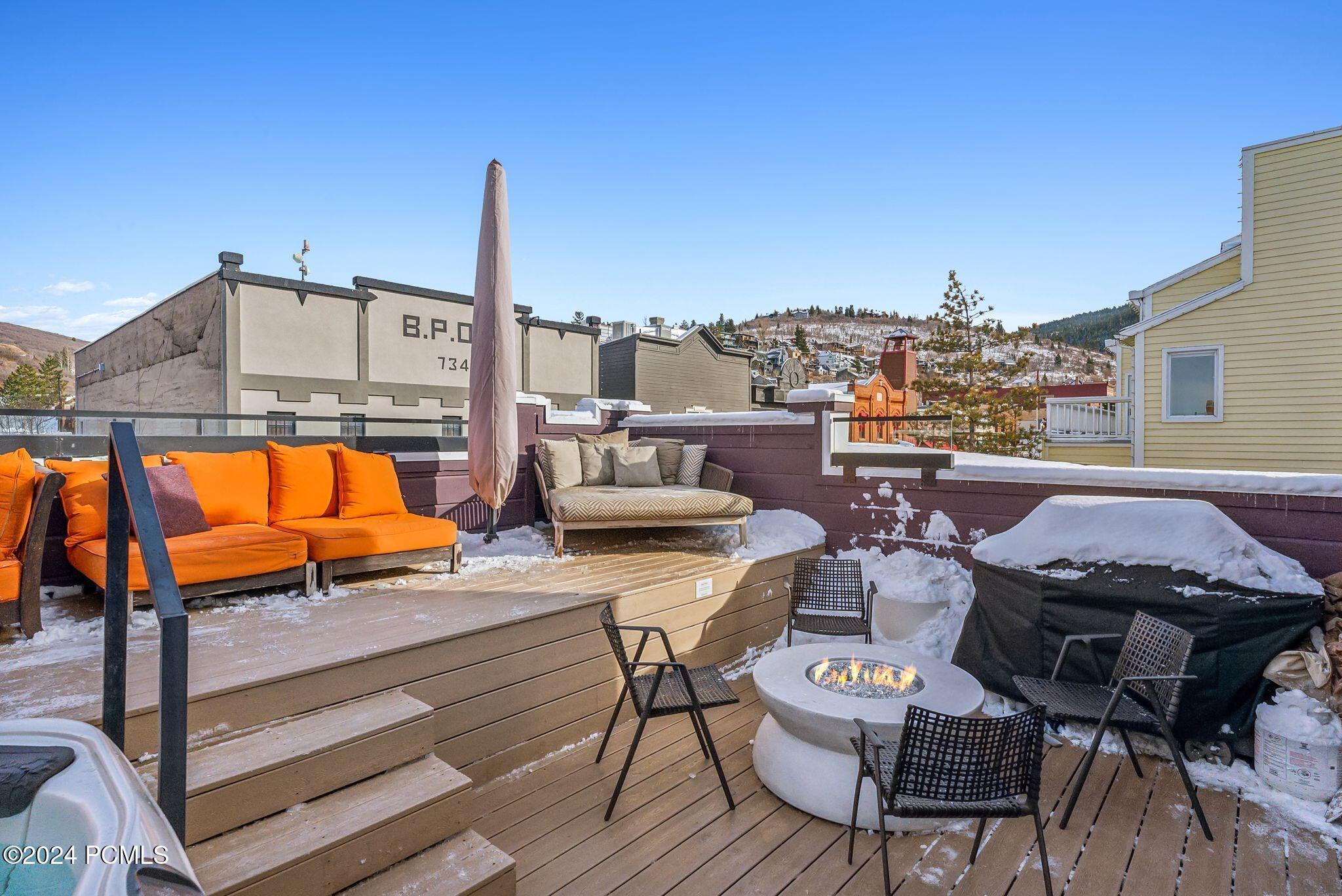 Rooftop lounge and fire pit with mountain views